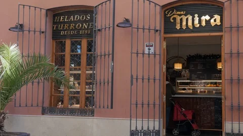 Facade of a famous old bakery named Mira selling ice cream and nougats Stock Footage 121762670
