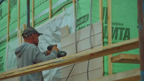 Facade finishing, installation of the house facade Stock Footage 344696569
