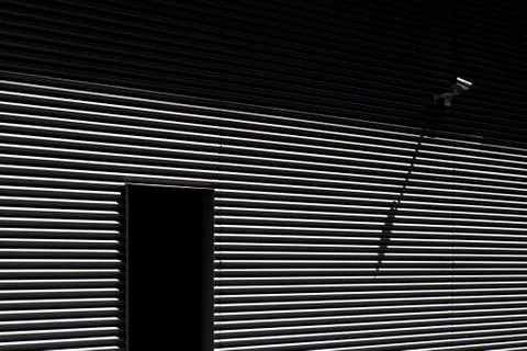 Facade of a generic building and a security camera 写真素材