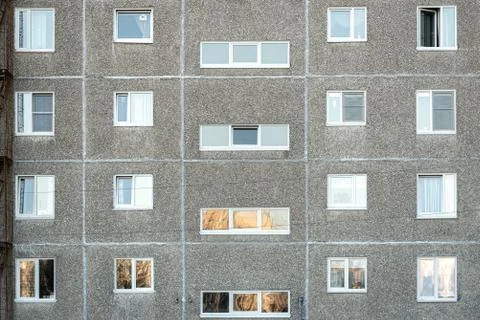 Facade of a grey multi-storey soviet panel building Foto stock