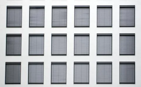 Facade with grey shutters Stock Photos