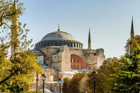Facade of Hagia Sofia and its cupola against the blue sky Stock Photos