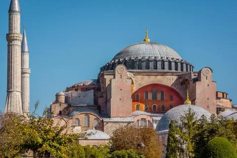 Facade of Hagia Sofia and its refulgent. cupola against the blue sky Stock Photos