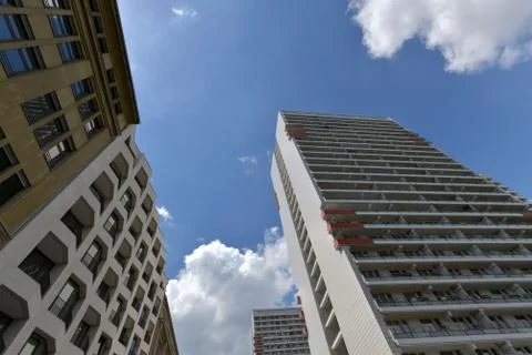 The facade of a high building with some windows closed by blinds Stock Photos