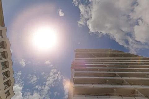 The facade of a high building with some windows closed by blinds Stock Photos