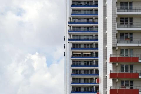 The facade of a high building with some windows closed by blinds Stock Photos