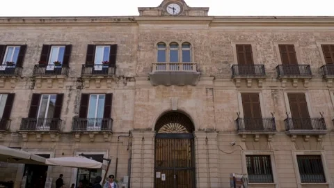 Facade historic building clock palace . City center of Ortigia. Tilt 4K 스톡 동영상 222724724