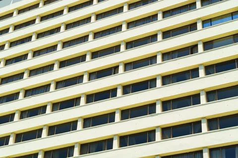 Facade of the hotel with the same windows Stock Photos