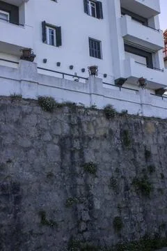 Facade of a house with a high foundation Stock Photos