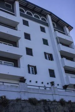 Facade of a house with a high foundation Fotos Stock