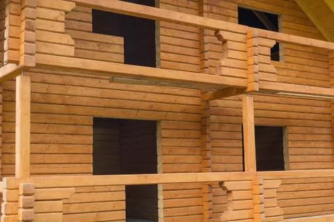 Facade of a house under construction from logs Stock Photos