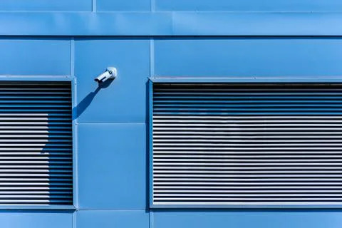 Facade of industrial building with security camera Fotos de archivo