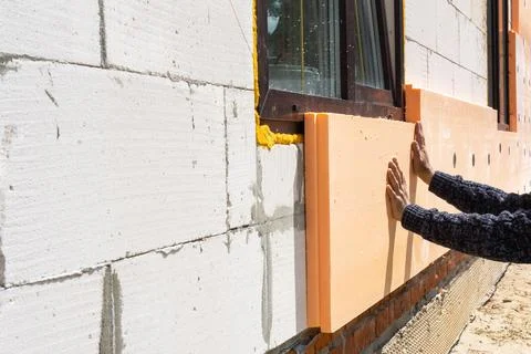 Facade insulation, foam board panel installation, house wall cladding, exte.. Fotos de archivo