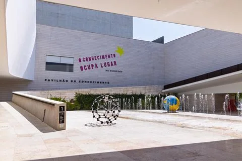 The facade of the Knowledge Pavilion features the name in Portuguese and a qu Stock Photos