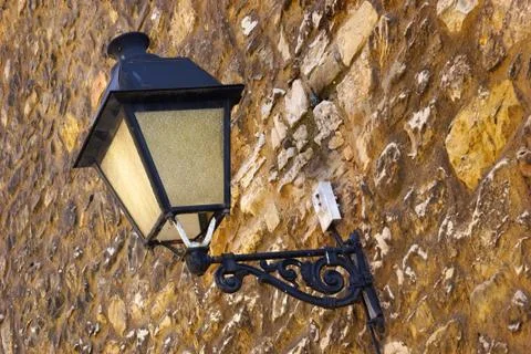 Facade with lamppost and stone Stock Photos