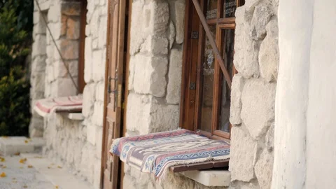 The facade of the medieval stone house in the Eastern style Stock Footage 125364260