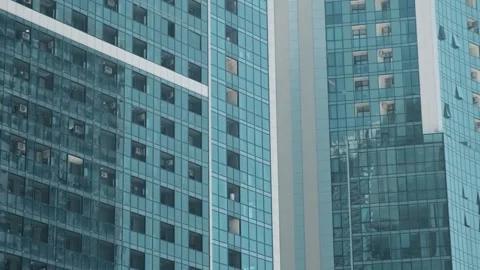 Facade of moderm multi storey glass building. Architecture abstract background Stock Footage 265892421