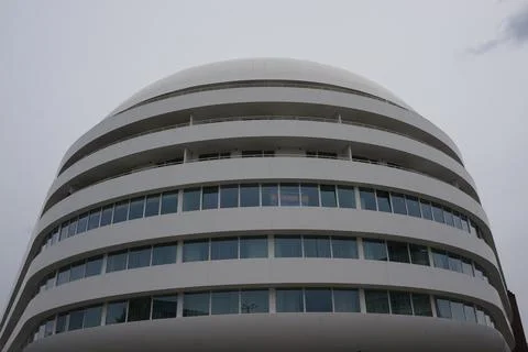 Facade of a modern building of rounded shape in Wroclaw Fotos de archivo