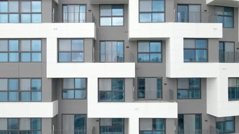 Facade of a modern gray building of residential complex close-up, urban geometry Stock Footage 243626804