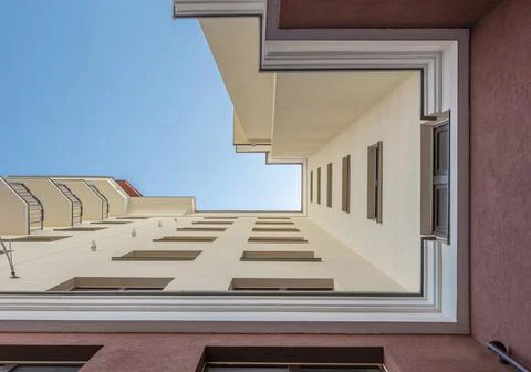Facade of modern multi-storey building in the city. Bottom view. Space for text Stock Photos