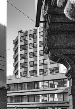 Facade of modern multi-storey building in the city. Black and white vertical Stock Photos