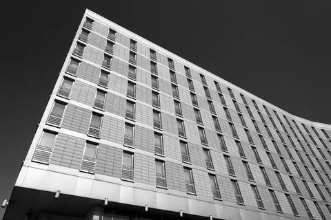 Facade of a modern, multi-storey building made of concrete and glass Stock Photos