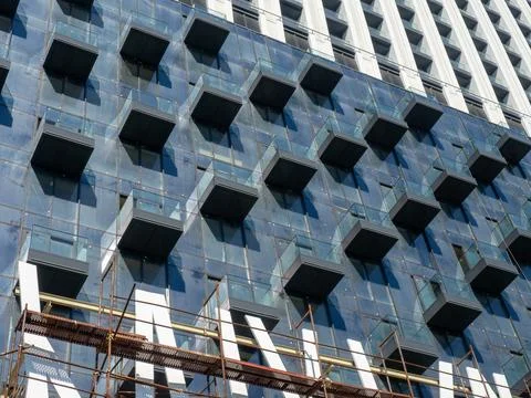 Facade of a modern multi-storey building. Balconies of a high-rise building.. Stock Photos