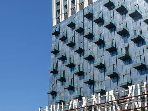 Facade of a modern multi-storey building. Balconies of a high-rise building.. Stock Photos