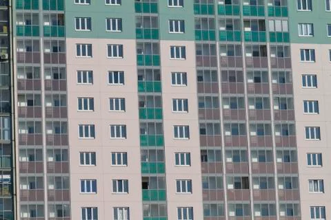 The facade of a modern multi-storey new residential building in Russia. Stock Photos