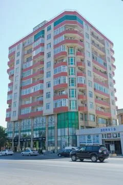 Facade of modern multi-storey new residential orange building near BAku . New Stock Photos