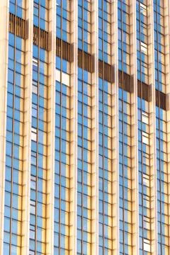 Facade of a modern office skyscraper. Geometric architectural lines create .. Stock Photos