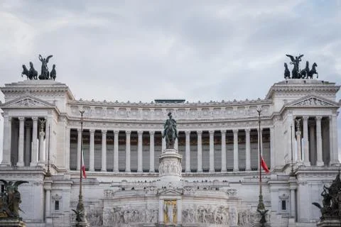 Facade of the Monument to Vittorio Emanuele II with the Italian flag in Rome Stock Photos