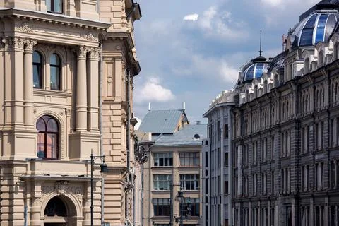 Facade of a monumental building with architectural elements of stucco. Stock Photos