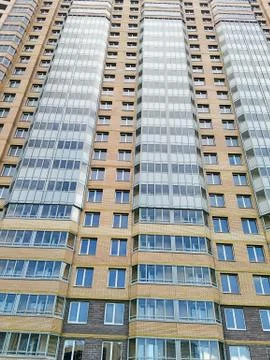 The facade of a multi-storey building. Stock Photos