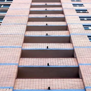 Facade of multi-storey house Stock Photos