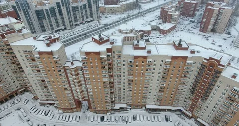 Facade of multistory building of outer-lying residential district, winter Video stock 99547834