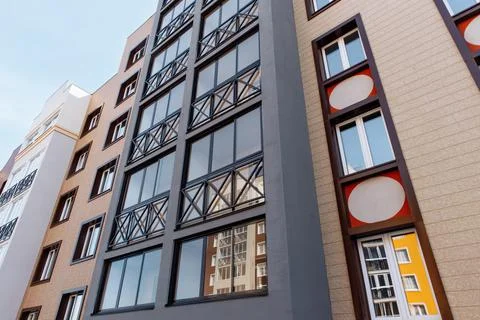 Facade of a new modern multi-storey brick house with compartments for a split Stock Photos