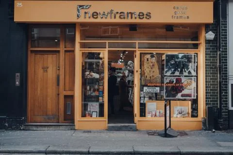 Facade of NewFrames framing shop in Soho, London, UK. Stock Photos
