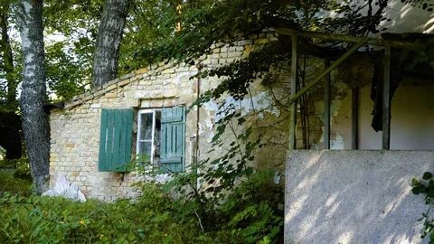 Facade of a old abandoned house with a open window Video stock 94433450