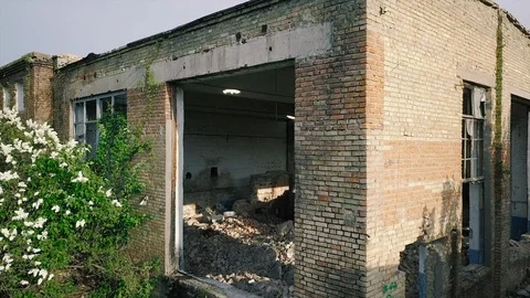 Facade of an old abandoned red brick building. Stained glass windows without Stock Footage 89997551