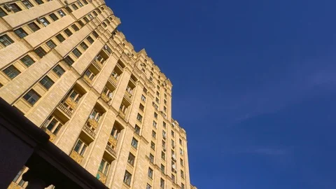 The facade of an old building with beautiful architecture. Stalin skyscraper. 4K Stock Footage 106015524