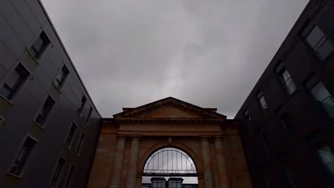 The facade of an old building between two modern ones Stock Footage 200213067