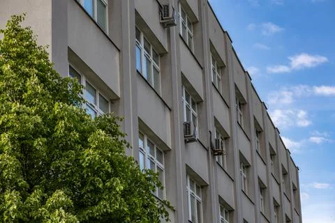 The facade of an old building equipped with modern air conditioning Stock Photos
