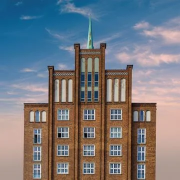 Facade of an old building in rostock with dramatic skyline in the background Stock Photos