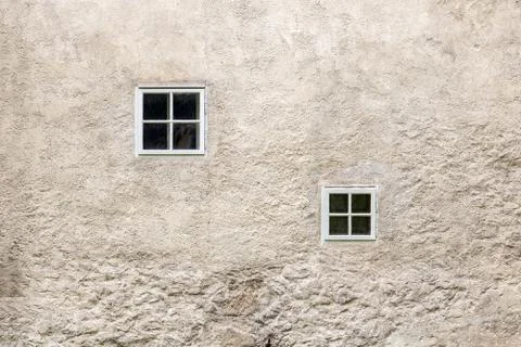 Facade of an old building with small windows Stock Photos