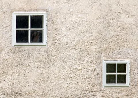 Facade of an old building with small windows Stock Photos