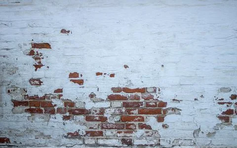 The facade of an old building. Texture of a red brick wall. Background painte Stock Photos