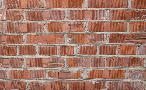 The facade of an old building. Texture of red brick wall background. Stock Photos