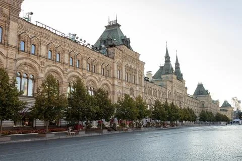 Facade of an old building, trees lined up. The building houses the GUM Stock Photos