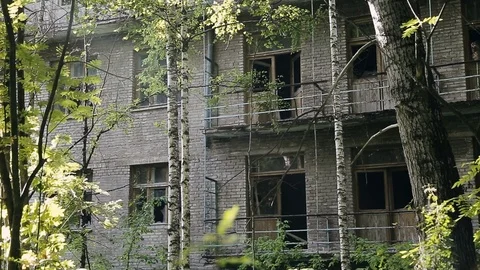 Facade old destroyed brick building with broken windows in industrial zone of Vídeos de archivo 110433655